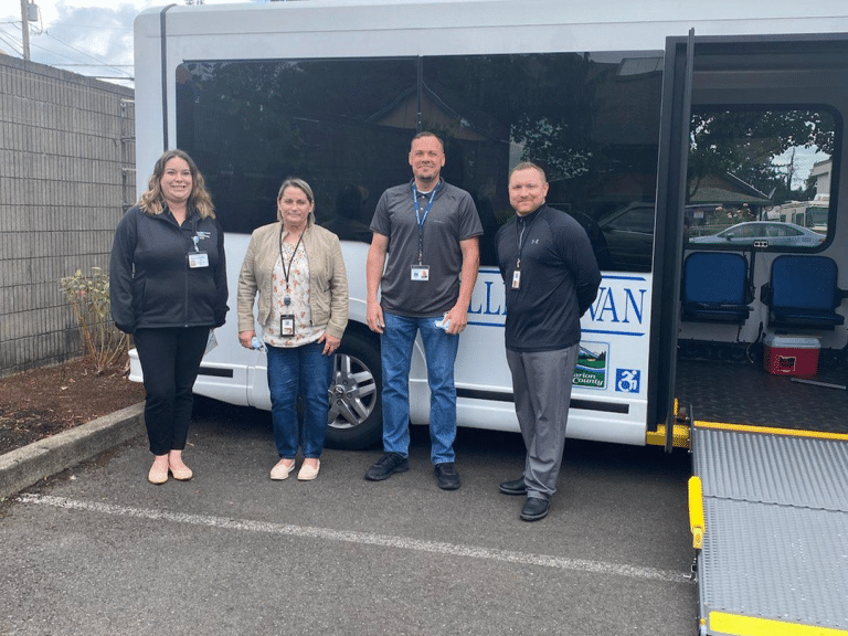SIT team members standing in front of the SIT Mobile van